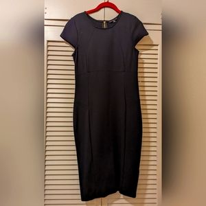 Black dress with a gold zipper down the back